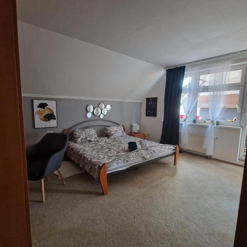 a bedroom with a bed and a large window at Bydlím U Arény in Nová Ves