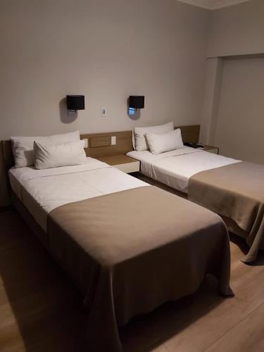 two beds in a hotel room with two at Hotel Riogrande in Santa Fe