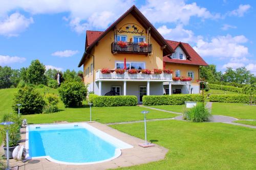 a house with a swimming pool in front of it at Pension Lammerhof in Unterlamm