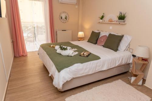 Postel nebo postele na pokoji v ubytování Athena Cocooning Apartment