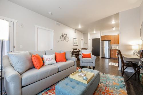 a living room with a couch and a table at Cute Condo TART Trail Bikes AC Downtown in Traverse City