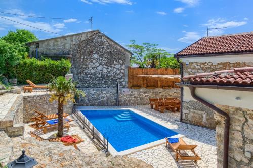 a pool in the backyard of a house at Villa Kirica in Bribir