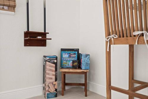 a table with some boxes on it next to a wall at Casa Isla Retreat - near Anna Maria Island in Bradenton
