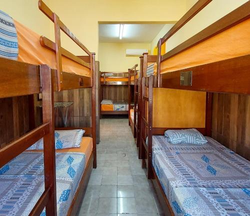 a group of bunk beds in a room at Hostel Pajeú in Triunfo