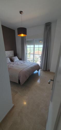 Postel nebo postele na pokoji v ubytování Manilva Heights