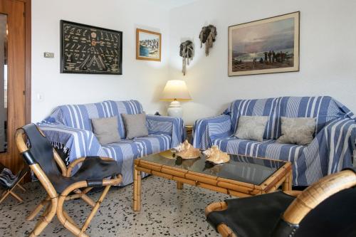 a living room with two couches and a coffee table at Cozy Apartment 50 meters beach in Calafell