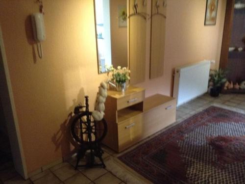 a living room with a dresser and a mirror at Glasner Comfortable holiday residence in Bad Camberg