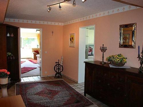 a living room with a dresser and a room at Glasner Comfortable holiday residence in Bad Camberg