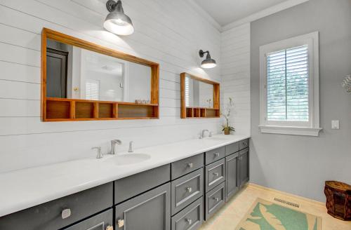 a bathroom with two sinks and a mirror at Fairway Oaks 42 by Wild Dunes, Home Close to Resort Core with Amenity Access in Isle of Palms