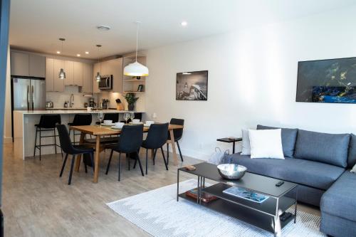 a living room with a couch and a table at Birdies and Bears by Revelstoke Vacations in Revelstoke