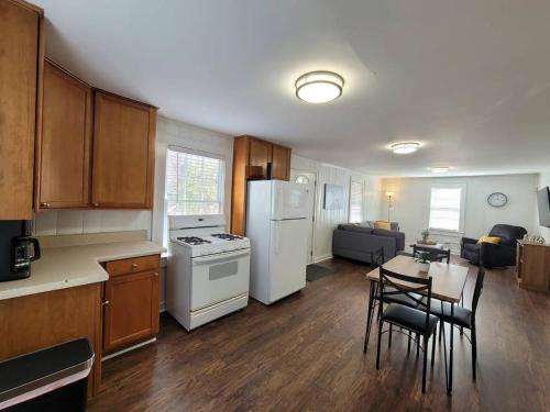 a kitchen and living room with a table and appliances at Private Getaway In Midtown 2bedroom- SLEEP 5 in Atlanta