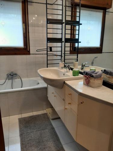 a bathroom with a sink and a bath tub at CASA DI IANA in Mestre