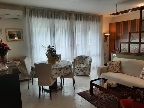 a living room with a couch and a table at CASA DI IANA in Mestre