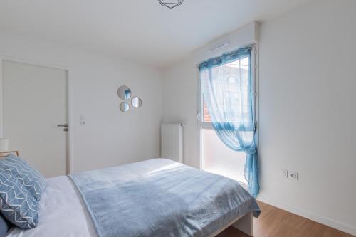 Ένα ή περισσότερα κρεβάτια σε δωμάτιο στο Bel Appartement gare Wifi