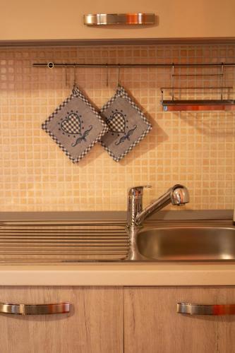 a sink in a kitchen with a counter top at Una rosa sul mare Monopoli in Monopoli