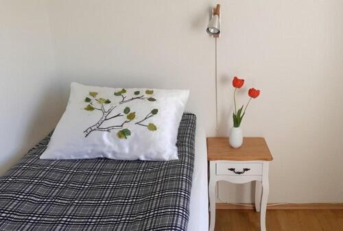 Postel nebo postele na pokoji v ubytování Guesthouse Tálknafjörður
