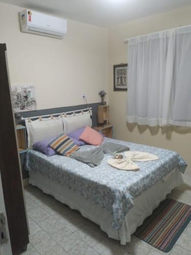 a bedroom with a large bed with at Pousada Suítes Meireles in Fortaleza