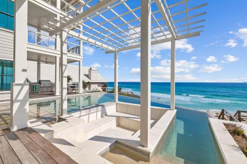 a view of the ocean from a house with a swimming pool at Del Mar in Seacrest