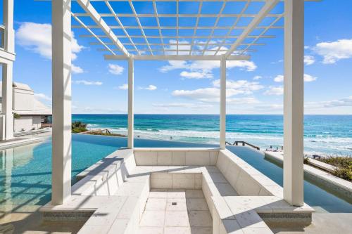 a view of the ocean from a house with a swimming pool at Del Mar in Seacrest