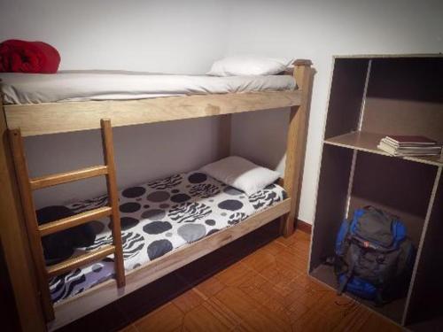 Dviaukštė lova arba lovos apgyvendinimo įstaigoje Hostal Be Cycle - Arví