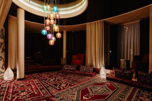 a room with a bed with a rug on it at Aroma Stone Hotel Spa in Syców