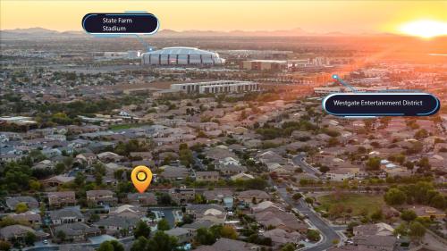 an aerial view of a city with the sun setting at Movie Theater Pool Arcade Fire Pit in Glendale