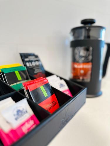 a box filled withiazepines and a coffee pot at La Quinta by Wyndham Ellerslie Auckland in Auckland