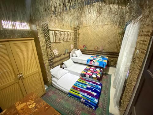 Postel nebo postele na pokoji v ubytování Pelemkecut Double-Degree Syariah Accommodation