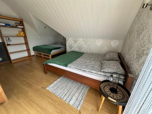 Postel nebo postele na pokoji v ubytování Domek na Kaszubach - Wczasy Zdunowice