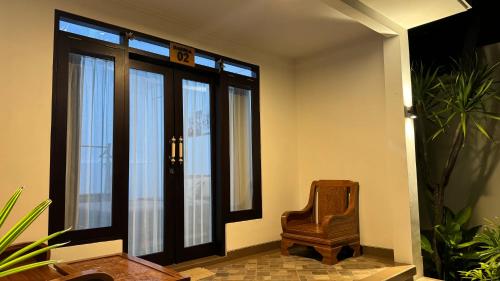 an empty room with a chair and a window at Batur lake view in Kintamani
