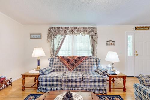 a living room with a bed and a window at Little River Retreat in Sparta