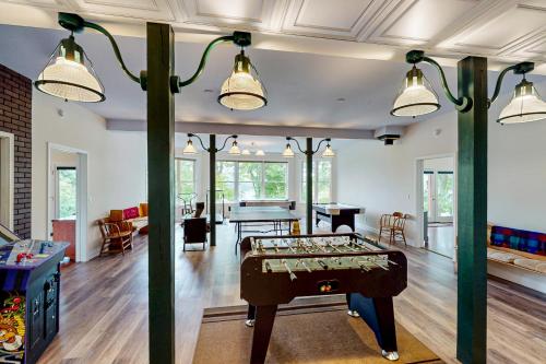 a room with a ping pong table in it at Still Waters in Moneta