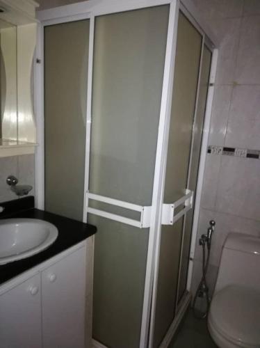 a bathroom with a shower and a toilet and a sink at VACATION APARTMENT IN COSTA AZUL i in Porlamar