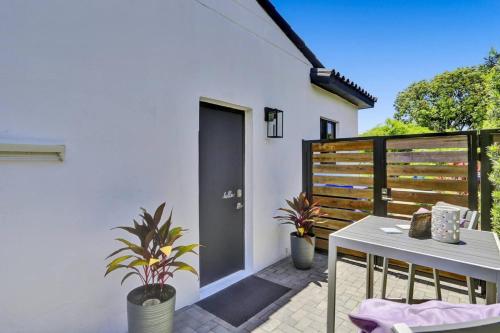 a patio with a table and a fence at Cozy Studio Apartment in Miami