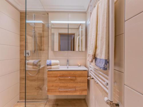 a bathroom with a sink and a shower at Johanna in Reith im Alpbachtal