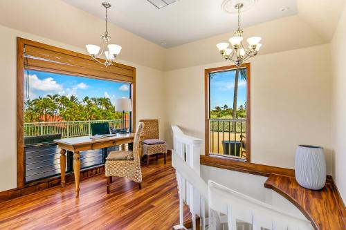 a home office with a desk and a window at Hale Imaka in Kipu