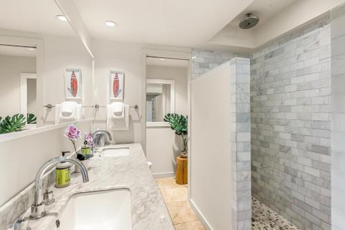a bathroom with a sink and a shower at Makahuena 1204 Ocean View in Koloa