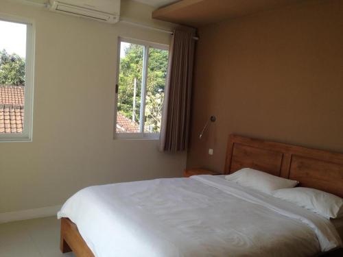 Кровать или кровати в номере Oxy House Bali