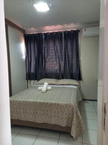 Кровать или кровати в номере Apartamento espaçoso e aconchegante
