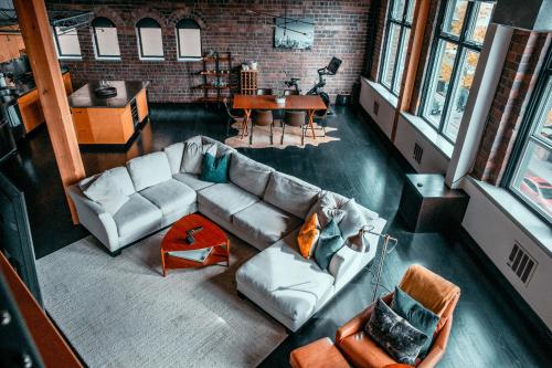 a living room with a couch and a table at Massive Downtown Seattle Condo - Free Parking! in Seattle