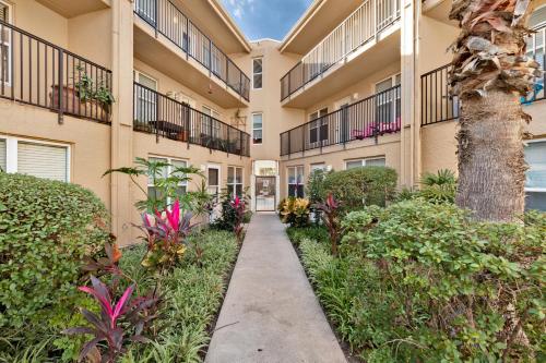 a walkway in front of a building with plants at La Casita at Surfside 103 in South Padre Island