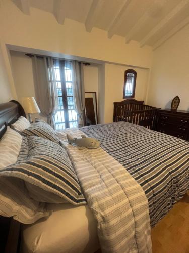 Ένα ή περισσότερα κρεβάτια σε δωμάτιο στο Pueblo Viejo Lecheria