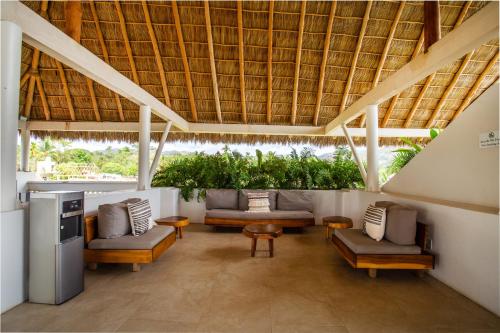 Agua de Luna Hotel Boutique, San Pancho Nayaritにあるシーティングエリア