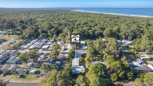 an aerial view of a parking lot next to the beach at Koala Lodge Studio 1 in Iluka