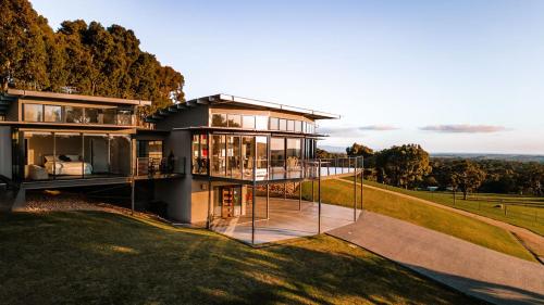 a large house with a lot of glass at McLaren Eye in Kangarilla