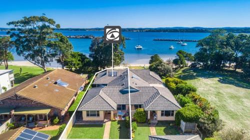 an overhead view of a house with a view of the water at River Luxury in Iluka