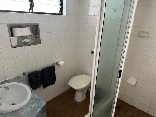 a bathroom with a toilet and a sink at Overlander Hotel in Mount Isa