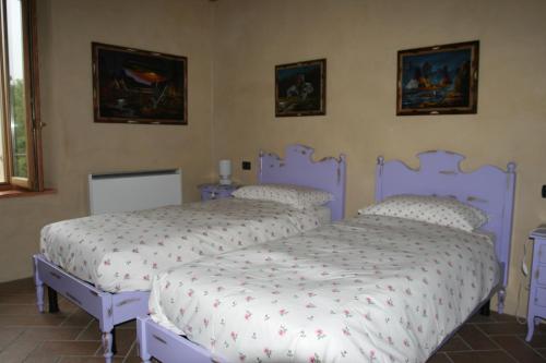 Ein Bett oder Betten in einem Zimmer der Unterkunft SacreTerre B&B e Agriturismo