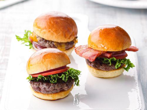 three hamburgers on buns with meat and lettuce at ORIENTAL HOTEL UNIVERSAL CITY in Osaka