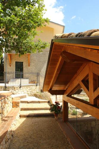 a building with stairs leading up to a house at Cominium Benessere in Alvito